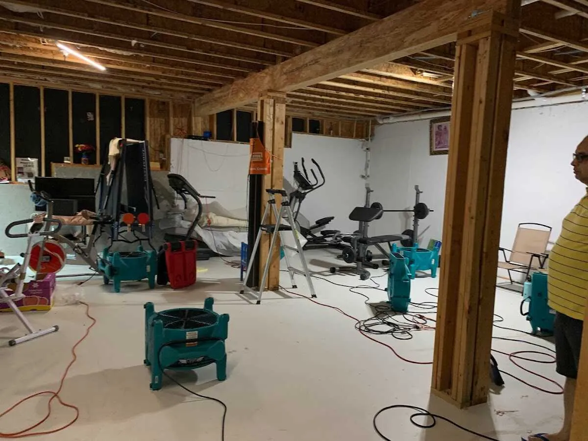 Basement drying equipment setup for Contents Cleaning & Restoration in Charles City